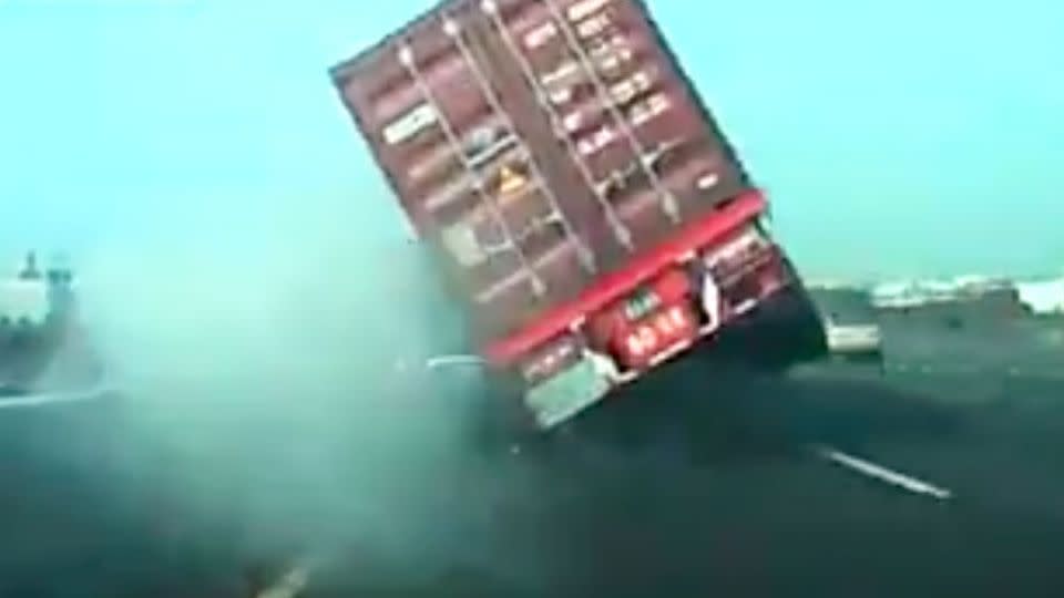 The semi-trailer is thrown off balance and tips on its side, crushing the two smaller vehicles. Photo: LiveLeak