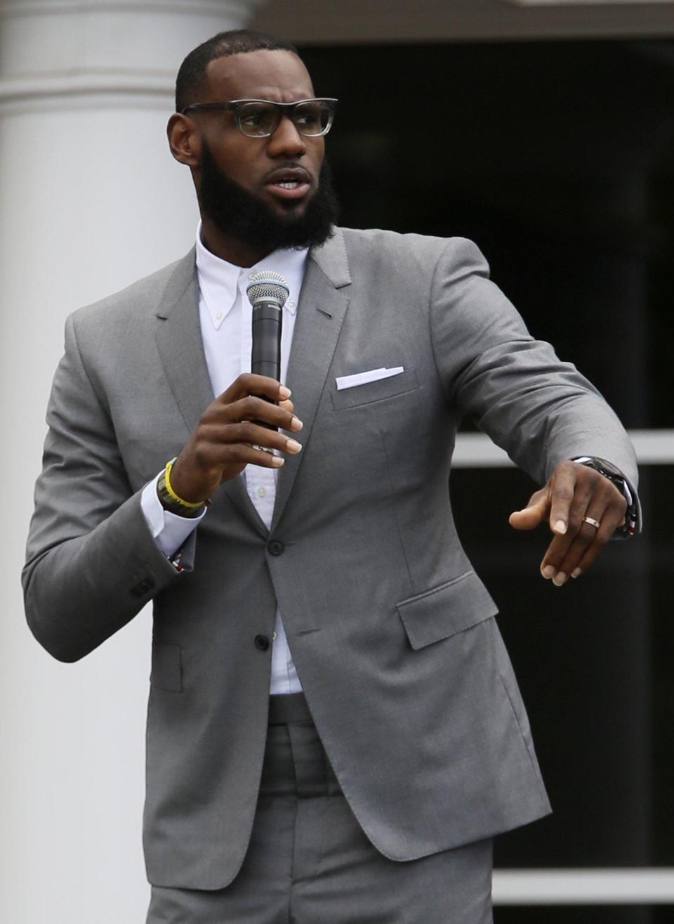 LeBron James reacts to a fan calling out support at the opening ceremony of the Akron Public Schools and LeBron James' I Promise School on July 30, 2018, in Akron.