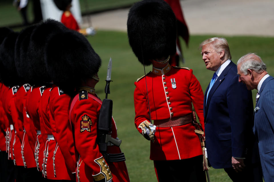 U.S. President Donald Trump and Britain's Prince Charles speak with guards during a welcome ceremony in Buckingham Palace, in London, Britain, June 3, 2019. REUTERS/Carlos Barria