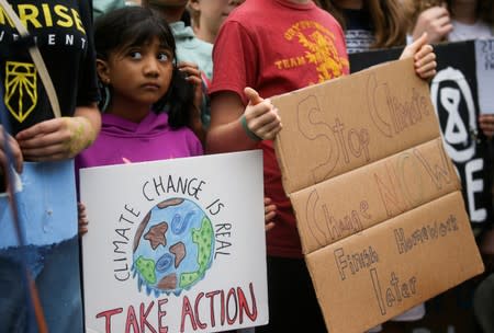 Environmental advocates rally near the White House in Washington