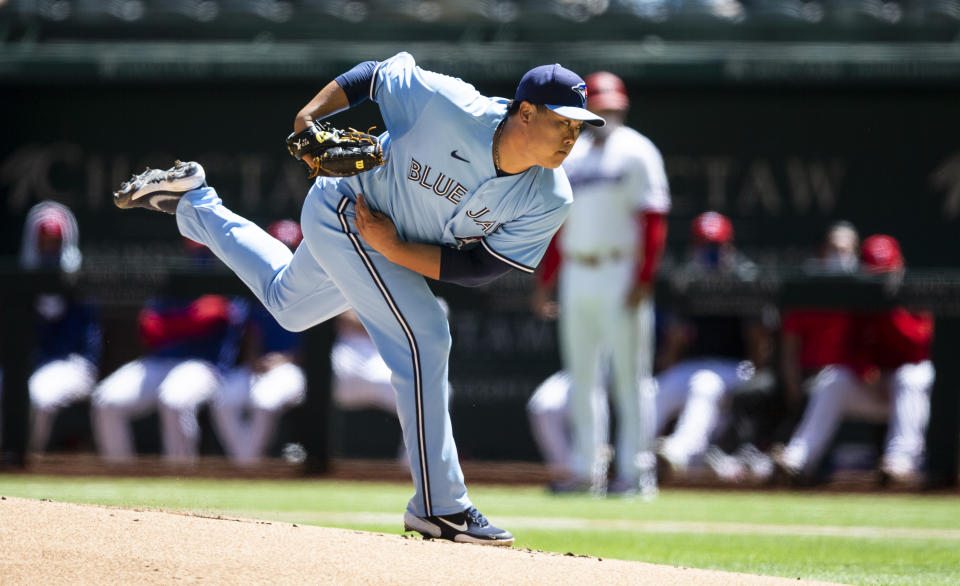 Toronto Blue Jays starting pitcher Hyun-Jin Ryu throws during the first inning of a baseball game against the Texas Rangers, Wednesday, April 7, 2021, in Arlington, Texas. (AP Photo/Brandon Wade)