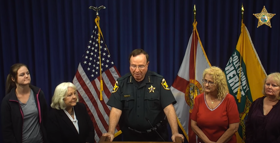 Teresa Lee Scalf’s family joined the sheriff at the news conference on the nurse’s homicide (Polk County Sheriff’s Office/YouTube)