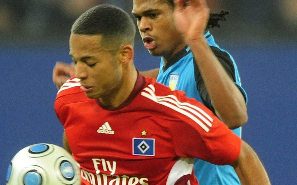 83949431...Hamburg's defender Dennis Aogo (L) vies with Aston Villa's Nathan Delfouneso during their UEFA Cup group F football match Hamburg vs Aston Villa on December 17, 2008 in Hamburg. AFP PHOTO DDP/ PHILIPP GUELLAND GERMANY OUT (Photo credit should read PHILIPP GUELLAND/AFP/Getty Images) -  PHILIPP GUELLAND/DDP