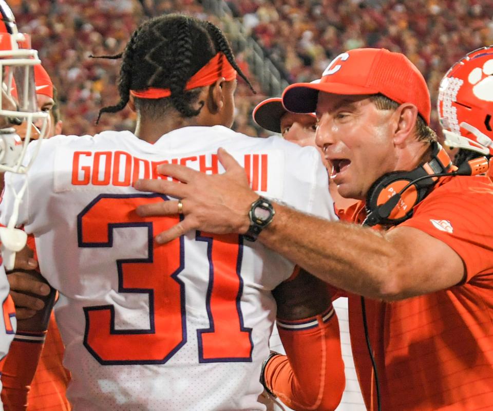 Clemson coach Dabo Swinney congratulates cornerback Mario Goodrich after he returned an interception for a touchdown in the Cheez-It Bowl.