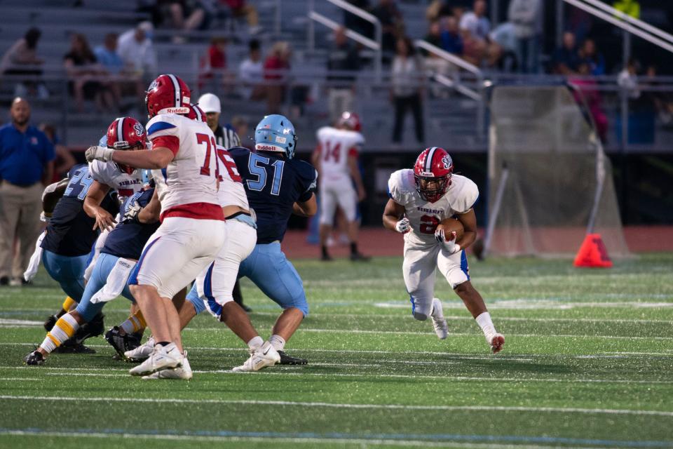 Neshaminy senior Markus Barnett looks for running room Friday night against North Penn.