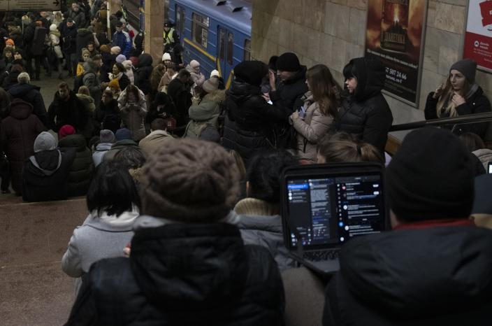 People rest in the subway station being used as a bomb shelter during a rocket attack in Kyiv, Ukraine, Monday, Dec. 5, 2022. Ukraine’s air force said it shot down more than 60 of about 70 missiles that Russia fired on in its latest barrage against Ukraine. It was the latest onslaught as part of Moscow’s new, stepped-up campaign that has largely targeted Ukrainian infrastructure and disrupted supplies of power, water and heat in the country as winter looms. (AP Photo/Andrew Kravchenko)