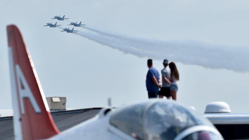 Spectators watch the United States Navy Blue Angels on the second and final day of the 2021 Kansas City Airshow at the New Century AirCenter in New Century, Kansas, Sunday, July 4, 2021.