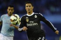 Real Madrid's forward Cristiano Ronaldo runs for the ball during the Spanish league football match against Celta Vigo in Vigo on April 26, 2015