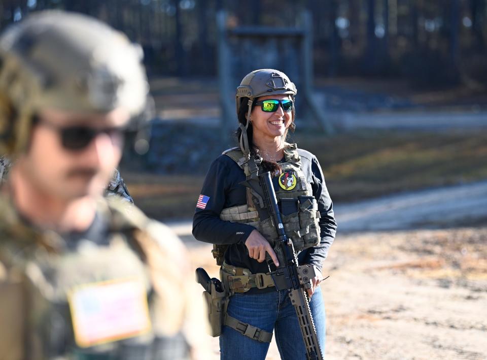 Former Congresswoman Tulsi Gabbard loads ammo before prepares to shoot an M4 rifle during the 2021 Tactical Challenge at the U.S. Army John F. Kennedy Special Warfare Center and School's Miller Training Complex  on Dec. 16, 2021. Twelve celebrities teamed up with Green Berets to take part in the annual event.