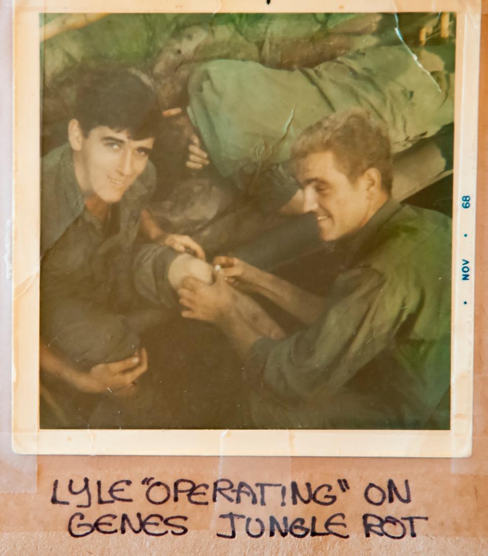 Lyle Bowes of Brookings is shown helping his friend and fellow soldier Gene Murphy tend to sores on his legs. "Jungle rot" was common for soldiers in the Vietnam War.