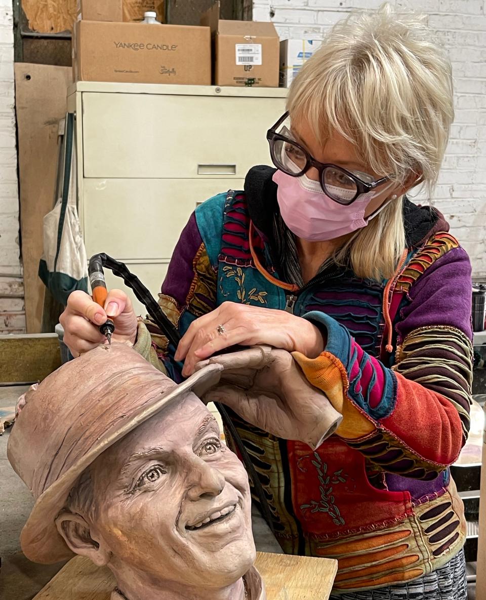 Chester native Carolyn Palmer works in her studio on a bronze statue of Frank Sinatra. The statue now stands in Sinatra's hometown of Hoboken, New Jersey.