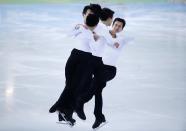 Patrick Chan of Canada skates during a figure skating training session in preparation for the 2014 Sochi Winter Olympics, February 2, 2014. This is an in-camera, multiple exposure photograph. REUTERS/Lucy Nicholson