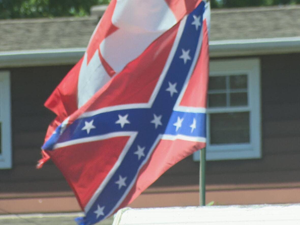 A Confederate flag has been flying at a home in Wheatley, Ont., for 24 years, according to the homeowner. (Jason Viau/CBC - image credit)