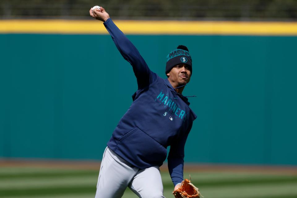 Seattle Mariners center fielder Julio Rodriguez warms up before playing the Guardians, Friday, April 7, 2023, in Cleveland.