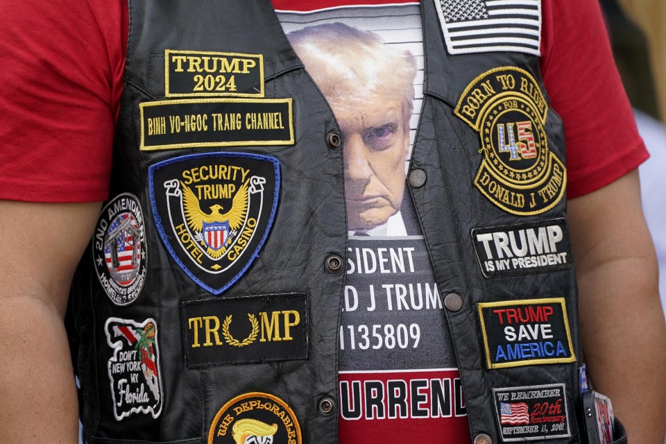 A supporter waits to enter a commit to caucus rally for former President Donald Trump, Wednesday, Sept. 20, 2023, in Maquoketa, Iowa. (AP Photo/Charlie Neibergall)