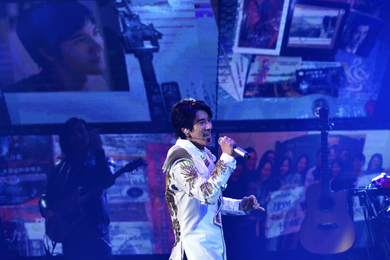 Wang Leehom, an American songwriter and singer sings during his solo concert in Nanjing in east China's Jiangsu province on May 20, 2018. Wang, who is one of the biggest pop stars in China apologized to his family and fans on Monday and said he would take a break from performing after a public dispute on social media with his ex-wife, who accused him of infidelity and hiring prostitutes. (Chinatopix via AP)