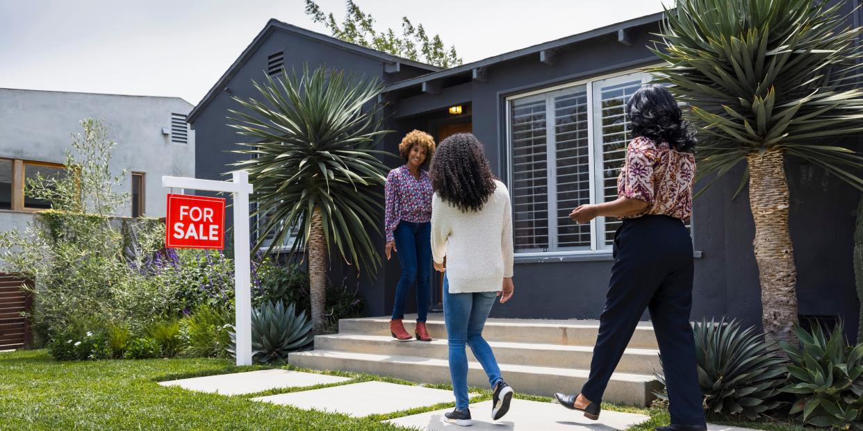 Potential homebuyers and a real estate agent.