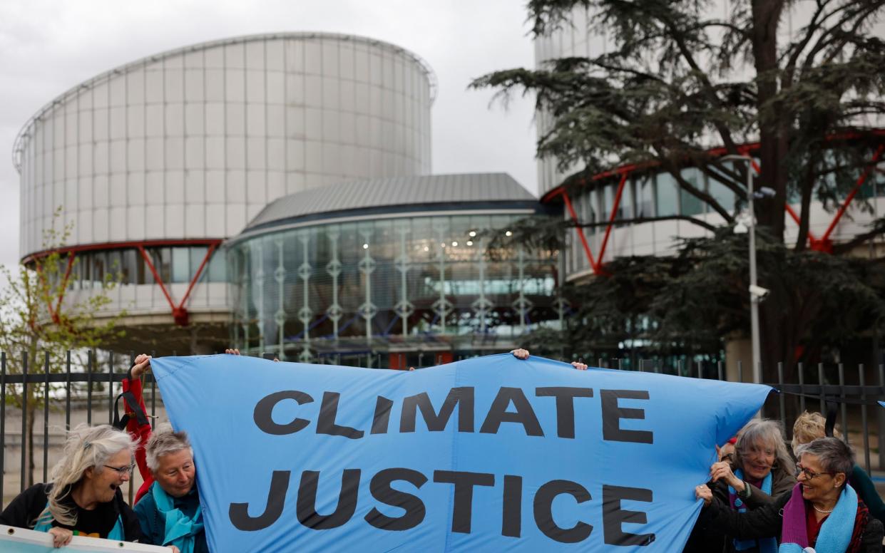 People demonstrate outside the European Court of Human Rights