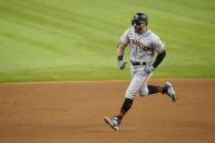 San Francisco Giants' Mike Tauchman celebrates as he rounds second after hitting a grand slam off Texas Rangers reliever Josh Sborz during the eighth inning of a baseball game in Arlington, Texas, Tuesday, June 8, 2021. (AP Photo/Tony Gutierrez)