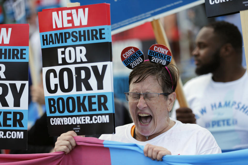 Cynthia Audesse, of Manchester, N.H., a supporter of Democratic presidential candidate Sen. Cory Booker, D-N.J, cheers during a rally outside the New Hampshire state Democratic Party convention, Saturday, Sept. 7, 2019, in Manchester, NH. (AP Photo/Robert F. Bukaty)