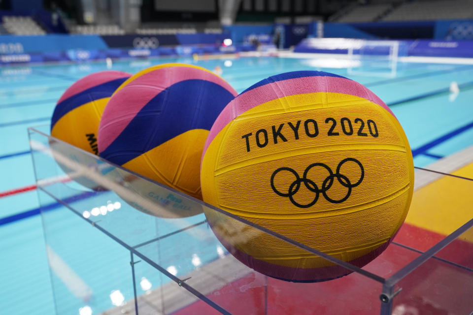 Water polo balls sit in a rack before a preliminary round women's water polo match at the 2020 Summer Olympics, Wednesday, July 28, 2021, in Tokyo, Japan. (AP Photo/Mark Humphrey)