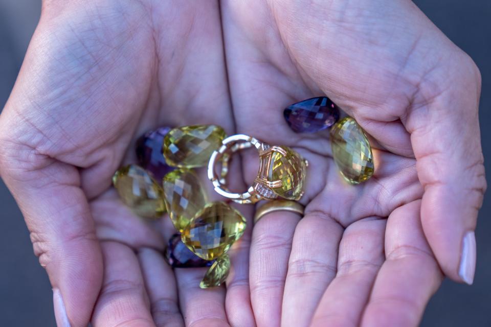 Denise Monti, a coowner of Jewels From Ipanema, holds jewelry as she poses for a portrait at the Barrett-Jackson Scottsdale Auction held at WestWorld in Scottsdale on January 26, 2024.