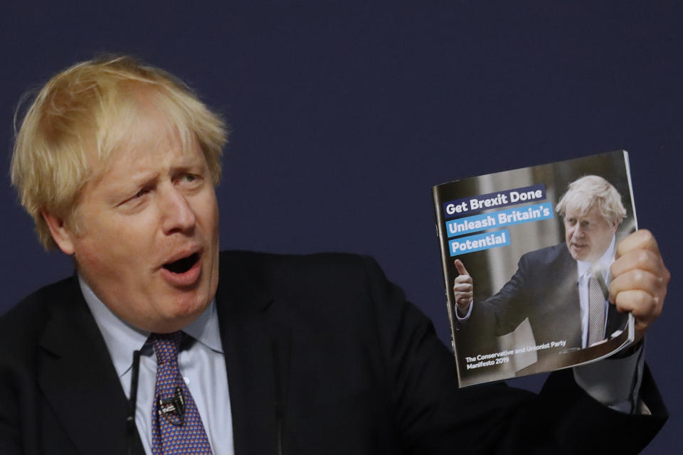 Britain's Prime Minister Boris Johnson presents the Conservative Party's Manifesto for the General Election campaign, in Telford, England, Sunday, Nov. 24, 2019. Britain goes to the polls on Dec. 12. (AP Photo/Frank Augstein)