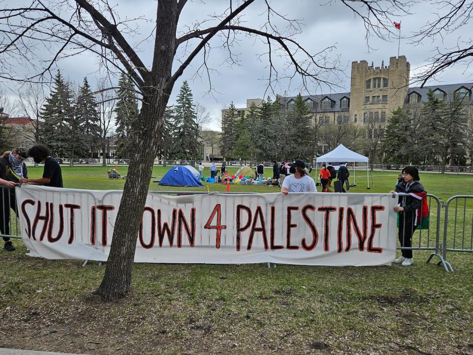 About two dozen people were on hand at the start of the protest at the U of M Tuesday morning.