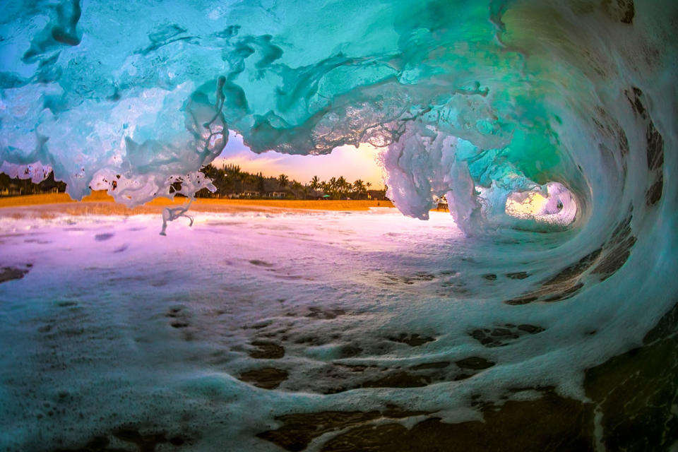 Smooth waves bursting with color give inside view of surfer’s paradise