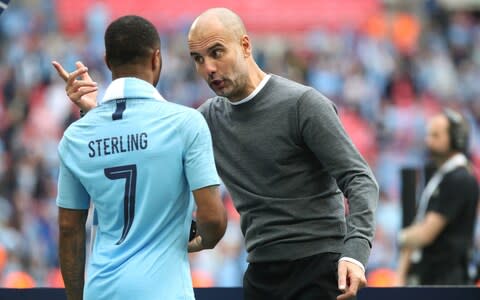 Manchester City's Raheem Sterling and manager Pep Guardiola during the FA Cup Final at Wembley Stadium - Credit: pa