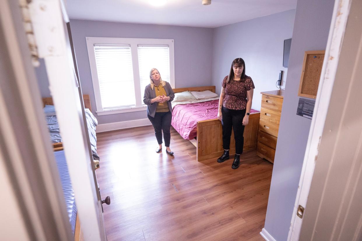 Kristina Drummer, executive director of Alliance Area Domestic Violence Shelter, left, and Hannah Schmid, the shelter's community engagement specialist, show off a family room at the shelter on Thursday, April 18, 2024.