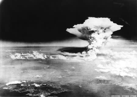 An atomic cloud billows, following the explosion of the first atomic bomb to be used in warfare in Hiroshima, Japan, in this handout photo taken by U.A. Army on August 6, 1945, and distributed by the Hiroshima Peace Memorial Museum. The word written on the photo are from source. Mandatory credit REUTERS/U.S. Army/Hiroshima Peace Memorial Museum/Handout via Reuters