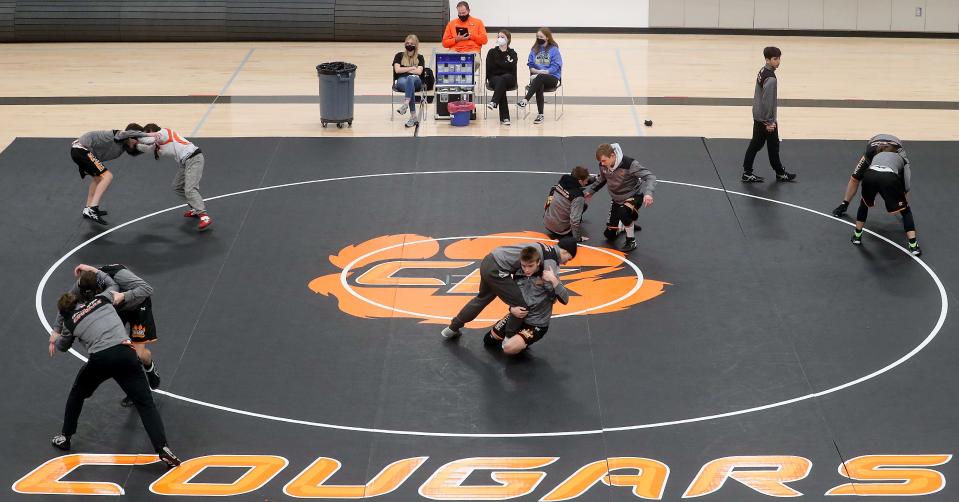 Central Kitsap wrestlers warm up on the mat prior to their match with Yelm on Thursday, Jan. 20, 2022.