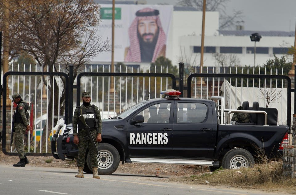 Pakistani paramilitary soldier stand guard near the presidency to ensure security ahead of Saudi Arabia's crown prince visit to Pakistan, in Islamabad, Pakistan, Sunday, Feb. 17, 2019. Saudi Crown Prince Mohammed bin Salman will arrive in Islamabad on Sunday evening on an official visit that is expected to include the signing of agreements for billions of dollars of investment in Pakistan. (AP Photo/Anjum Naveed)