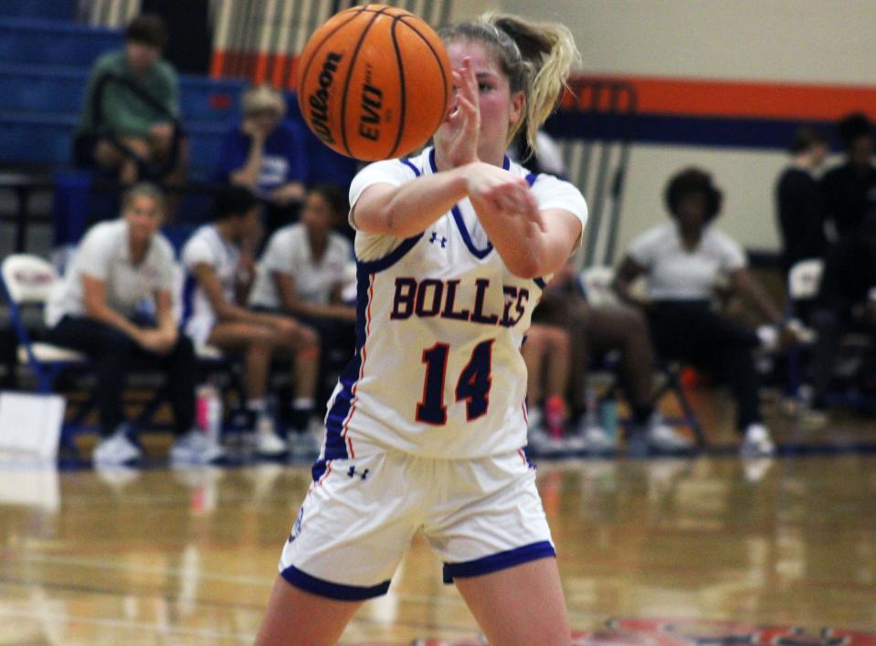 Bolles guard Abby Knauff (14) throws a pass during an Insider Exposure Thanksgiving Classic high school girls basketball game. The Bulldogs lead Northeast Florida in team scoring.