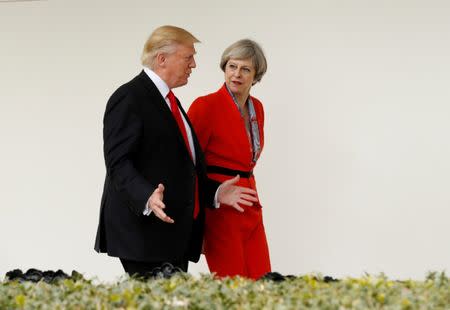 U.S. President Donald Trump escorts British Prime Minister Theresa May down the White House colonnade after their meeting at the White House in Washington, U.S., January 27, 2017. REUTERS/Kevin Lamarque/Files