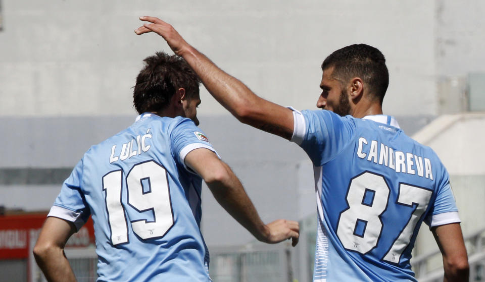 Lazio midfielder Senad Lulic, of Bosnia, celebrates with teammate Antonio Candreva, right, after scoring during a Serie A soccer match between Lazio and Sampdoria, at Rome's Olympic stadium, Sunday, April 6, 2014. (AP Photo/Riccardo De Luca)