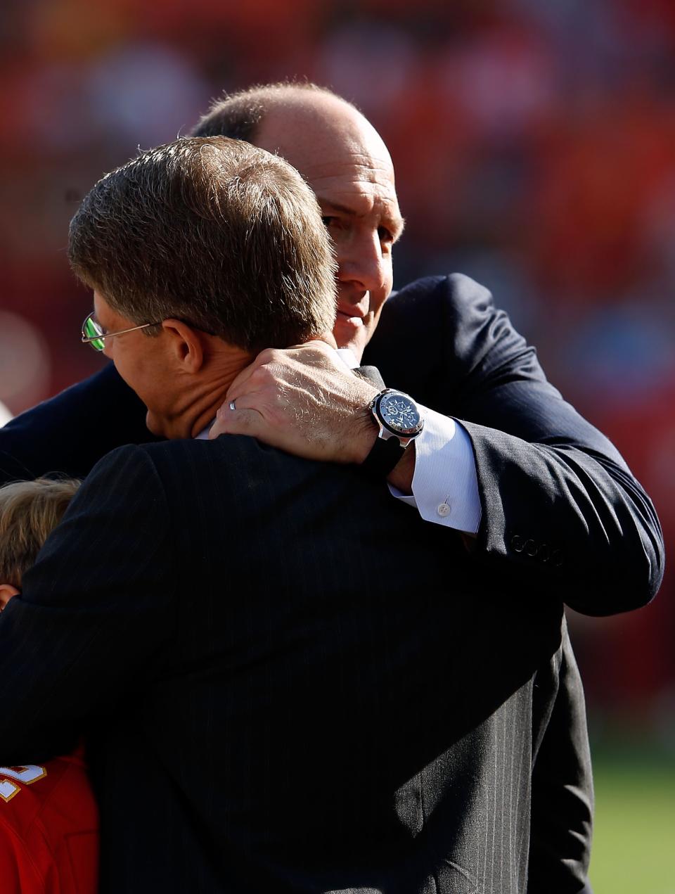 KANSAS CITY, MO - DECEMBER 02: General Manager Scott Pioli of the Kansas City Chiefs hugs owner Clark Hunt prior to the game against the Carolina Panthers at Arrowhead Stadium on December 2, 2012 in Kansas City, Missouri. (Photo by Jamie Squire/Getty Images)