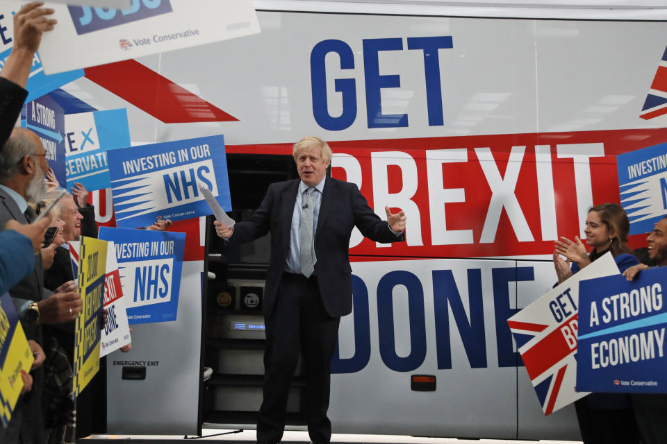 Britain's Prime Minister Boris Johnson during a General Election campaign trail stop at DPD express parcel delivery in Middleton, Manchester, England, Friday, Nov. 15, 2019. Britain goes to the polls on Dec. 12. (AP Photo/Frank Augstein, Pool)