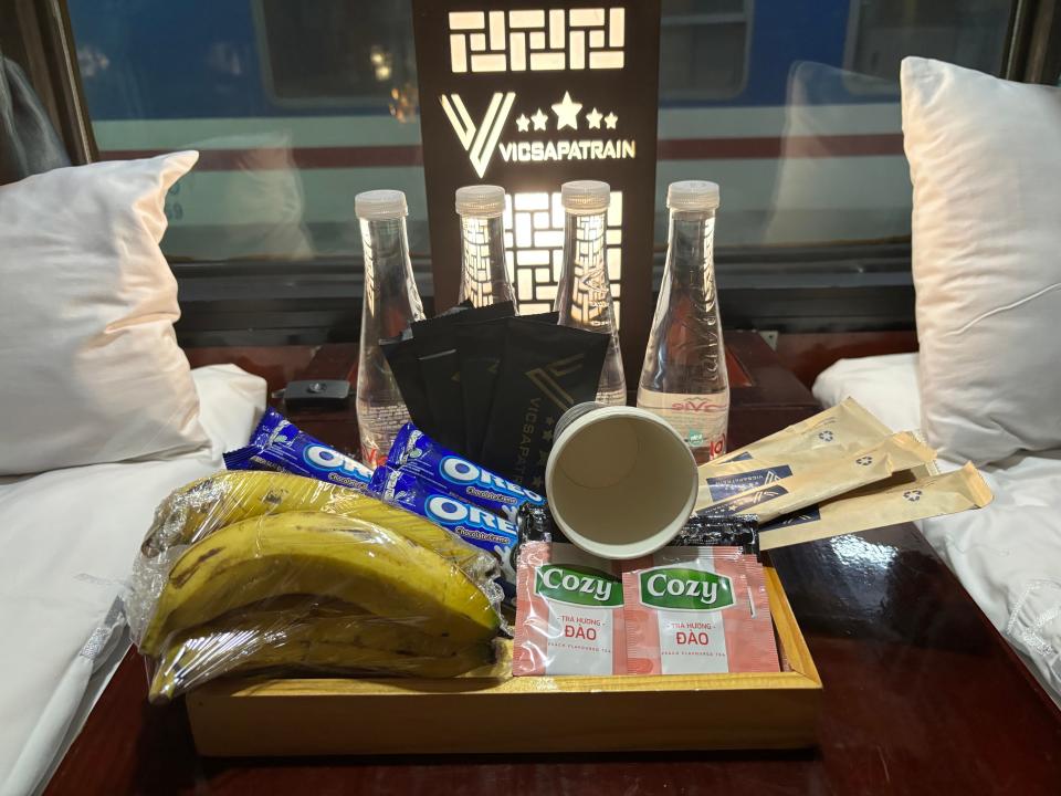 Bananas, water bottles, and snacks on train car