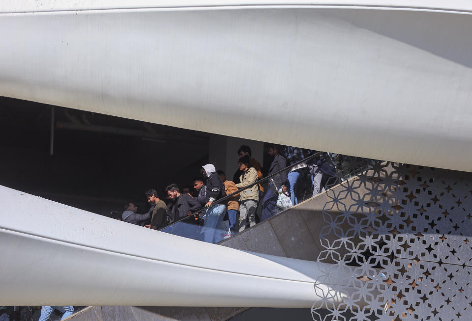 Iraqi soccer fans try to enter the Basra International Stadium in Basra, Iraq, Thursday, Jan 19, 2023. A stampede outside the stadium has killed and injured a number of people. (AP Photo/Anmar Khalil)