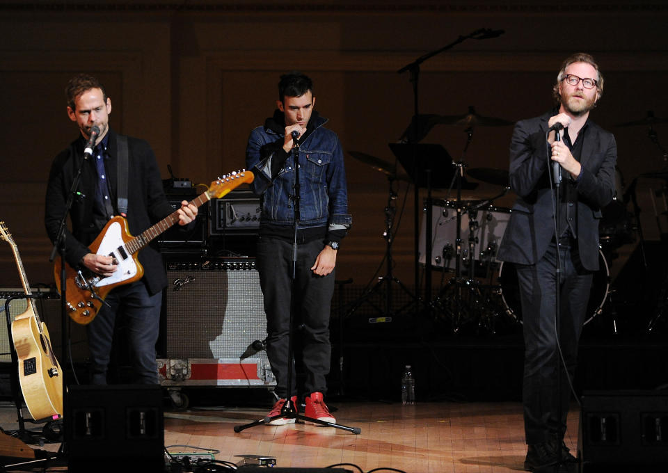 Musicians Bryce Dessner, left, and Matt Berninger, from the band The National, perform with Sufjan Stevens, center, at 24th Annual Tibet House U.S. benefit concert at Carnegie Hall on Tuesday, March 11, 2014, in New York. (Photo by Evan Agostini/Invision/AP)