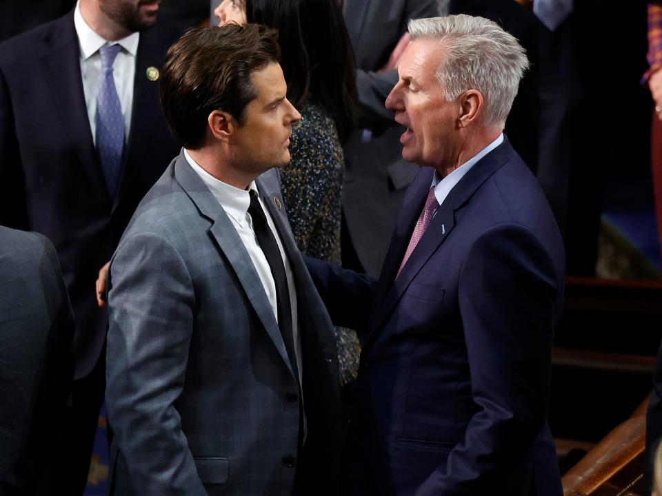 Rep. Matt Gaetz and Rep. Kevin McCarthy stand face to face in the House Chamber. McCarthy appears to be yelling at Gaetz.