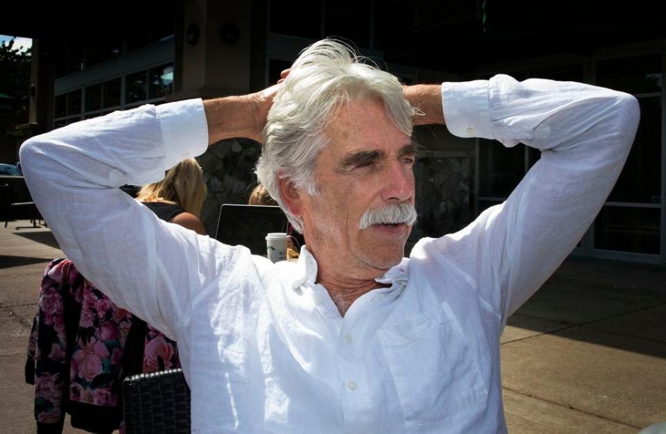 Sam Elliott soaks up the morning sun during a visit to a local coffee shop in Eugene.