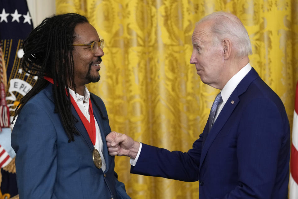 President Joe Biden presents the 2021 National Humanities Medal to Colson Whitehead at White House in Washington, Tuesday, March 21, 2023. (AP Photo/Susan Walsh)