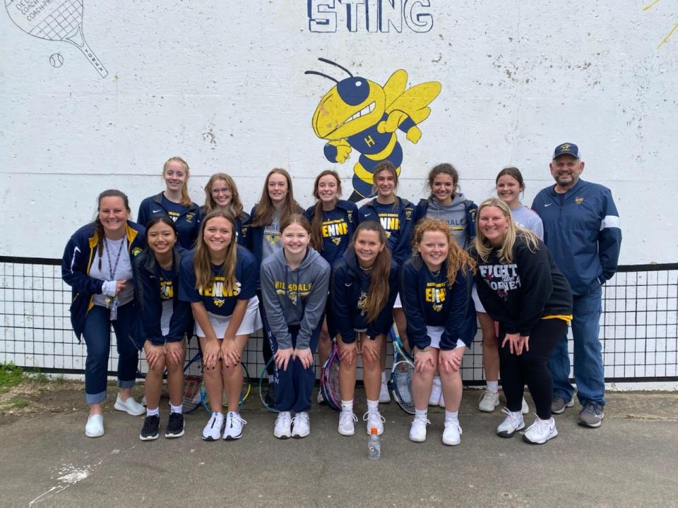 The Hillsdale girls tennis team and head coach Scott Phillips