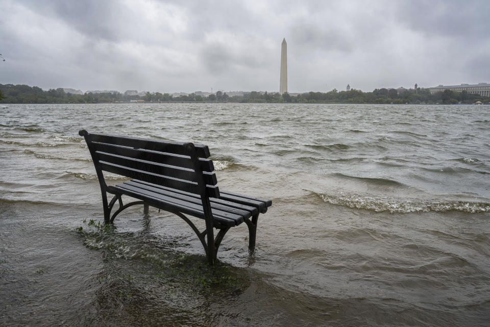 FILE - The Tidal Basin in Washington overflows the banks with rain from Tropical Storm Ophelia on Sept. 23, 2023, as the National Weather Service issued a coastal flooding warning for the area. (AP Photo/J. David Ake, File)