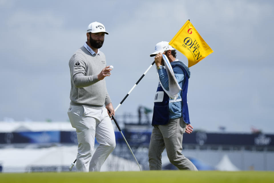 Spain's Jon Rahm acknowledges the crown after putting on the 6th green during the second day of the British Open Golf Championships at the Royal Liverpool Golf Club in Hoylake, England, Friday, July 21, 2023. (AP Photo/Jon Super)