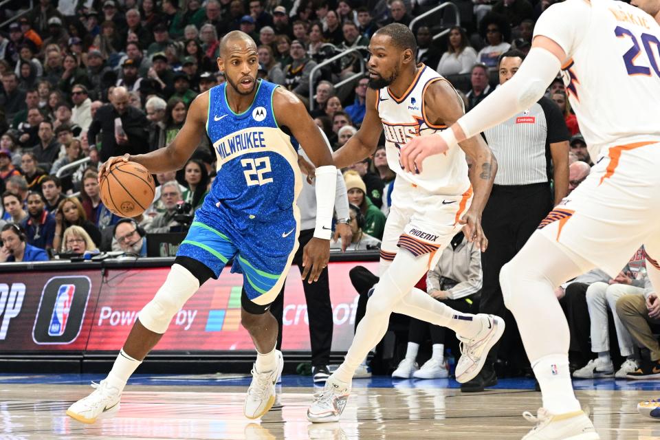 Bucks forward Khris Middleton drives against Suns forward Kevin Durant during the first half Sunday at Fiserv Forum.