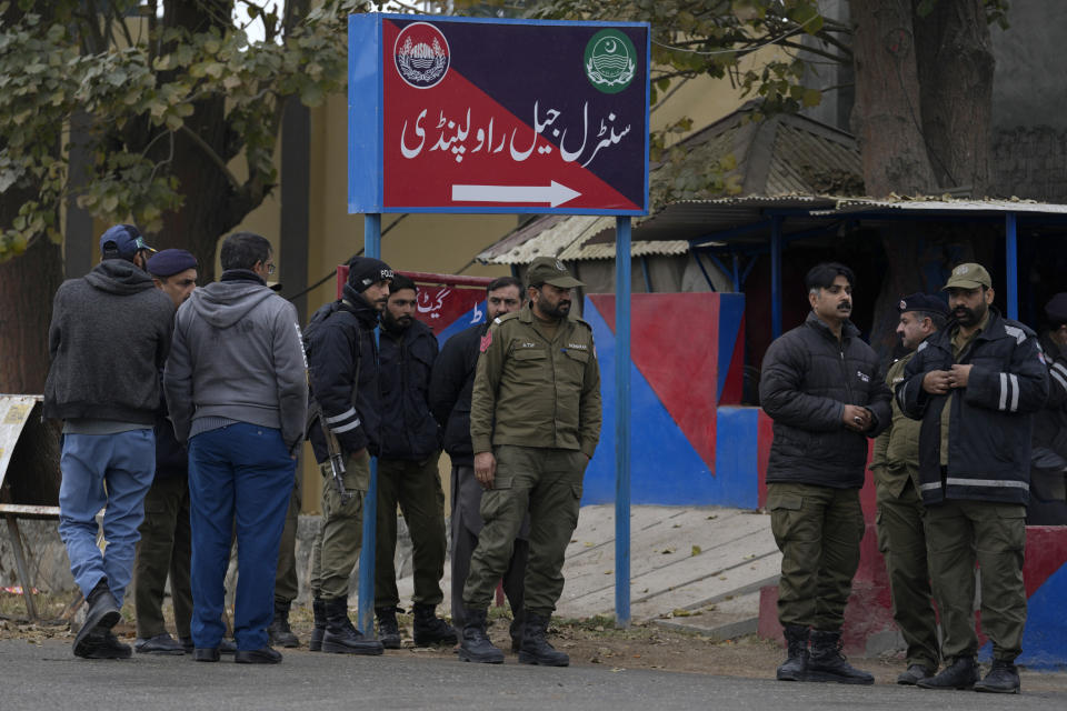 Police officers stand guard outside the Adiyala prison, where a special court proceeding going on for a case against Pakistan's former Prime Minister Imran Khan, in Rawalpindi, Pakistan, Tuesday, Jan. 30, 2024. A Pakistani court on Tuesday sentenced former Prime Minister Khan and one of his party deputy to 10 years in prison each, after finding them guilty of revealing official secrets. (AP Photo/Anjum Naveed)